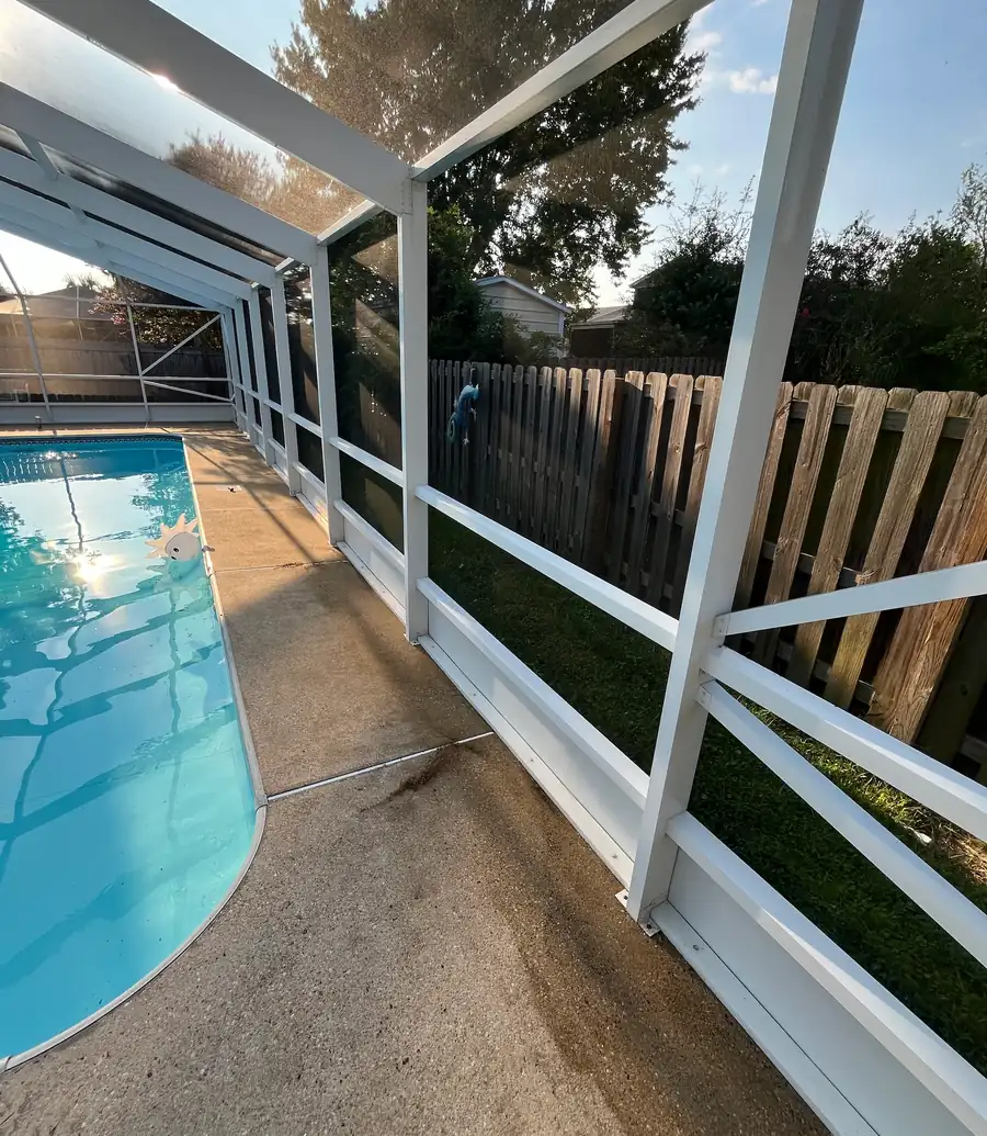 White aluminum pool cage frame after cleaning
