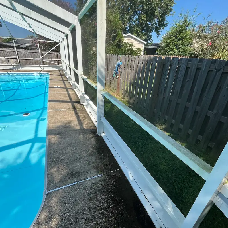 Pool cage frame streaked with dirt and mildew before cleaning