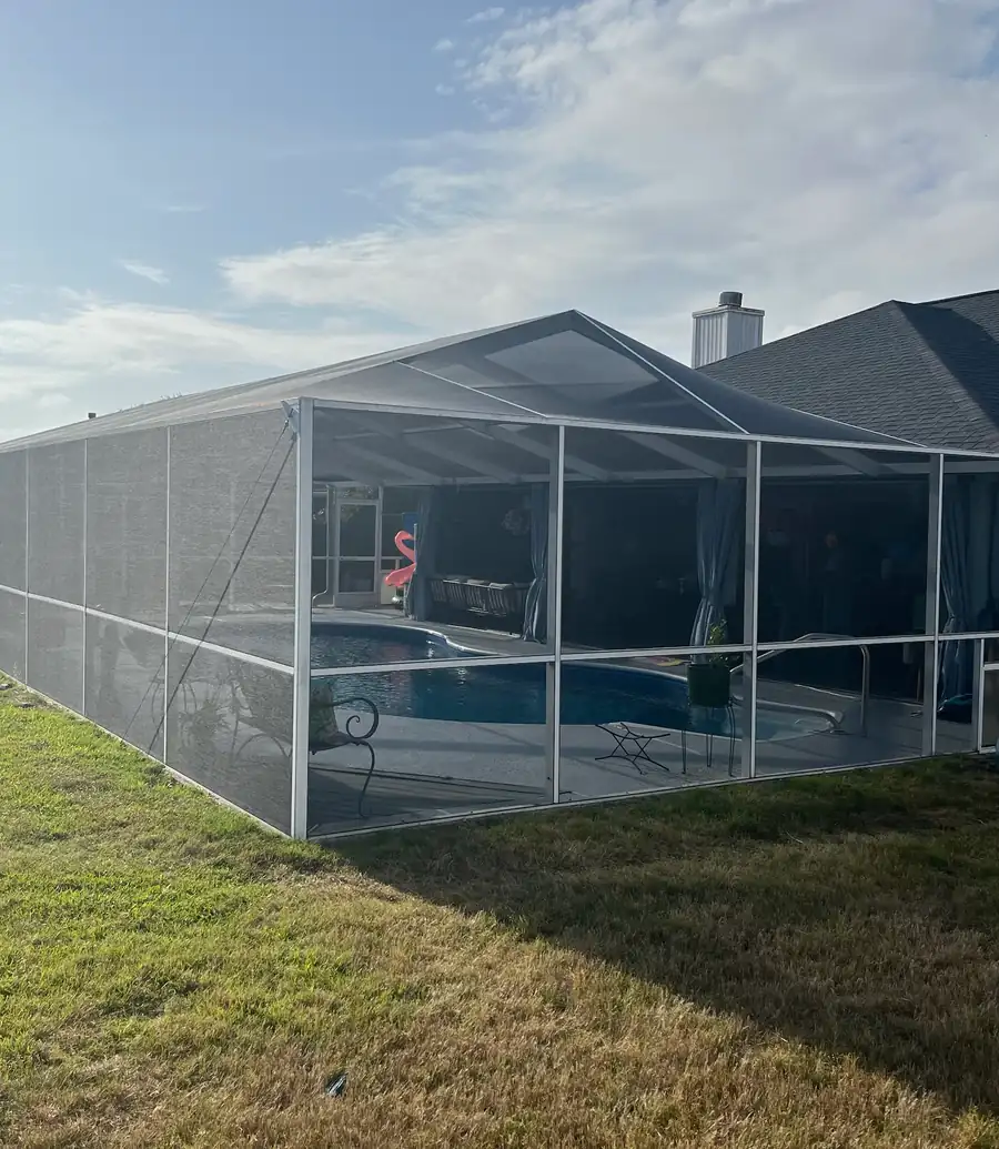 Pool cage enclosure with new screen installed on every panel