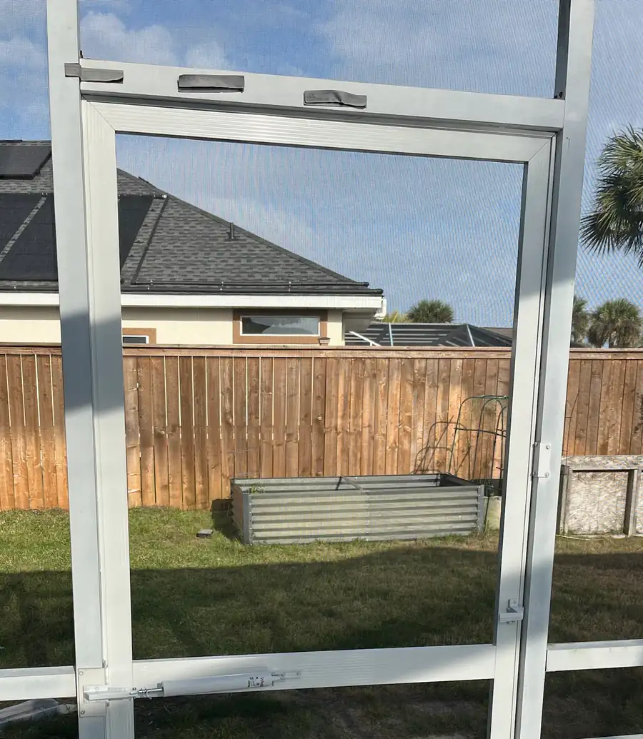 Replaced screen door with a new frame, screen and door closer on a pool enclosure