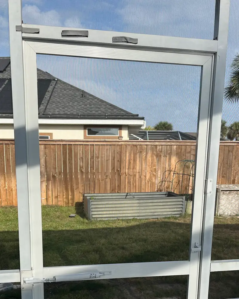 The same doorway with a new screen door, screen and door closer